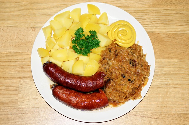 A meal on a plate with sauerkraut